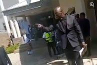 Screenshot from a video posted by Jay FM shows a Church of Christ in Nations (COCIN) leader following the dispute outside the church headquarters in Jos during the funeral service.